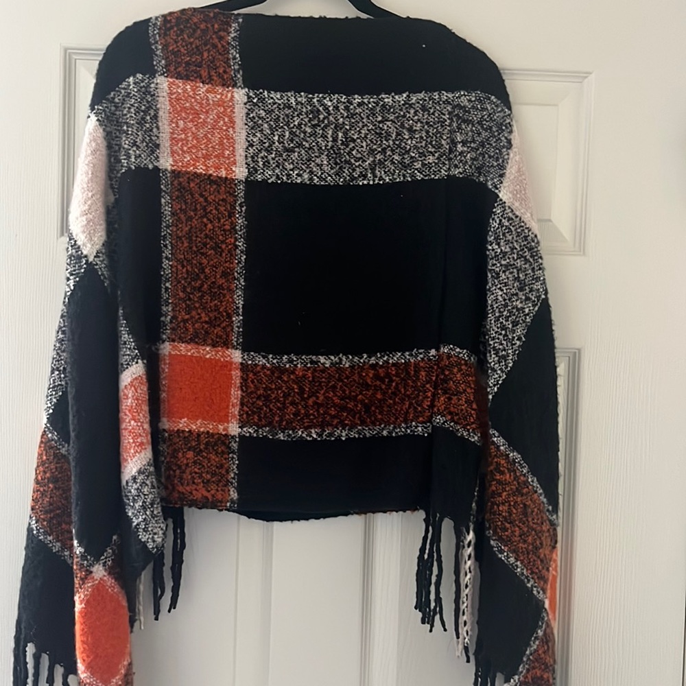 Black, orange and white pancho.